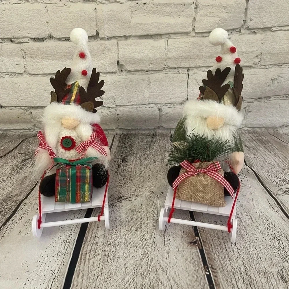 NIB! Two Christmas gnome figures on sleds